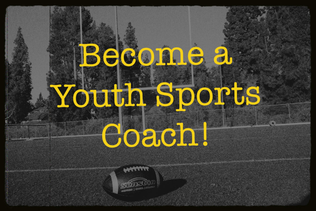 A lone football is laying on an empty football field. The yellow text overlay says: "Become a Youth Sports Coach!"