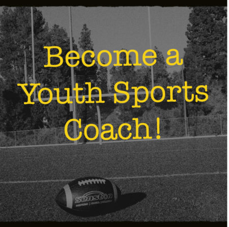 A lone football is laying on an empty football field. The yellow text overlay says: "Become a Youth Sports Coach!"