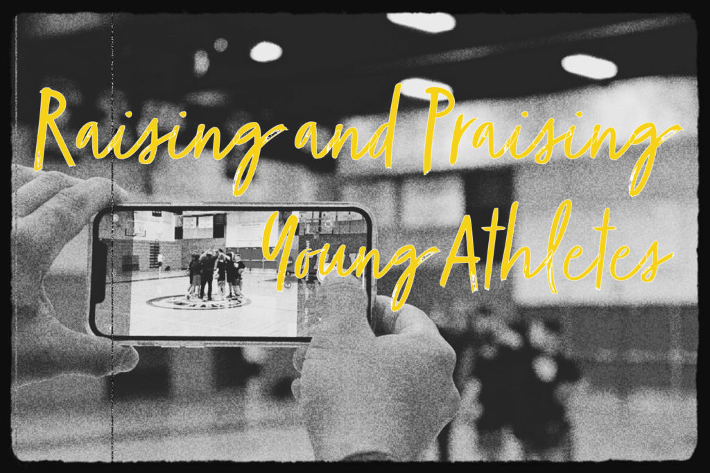 A parent is seen taking a picture of a team in a huddle with their coach at practice. The text overlay says: "Raising and praising young athletes".