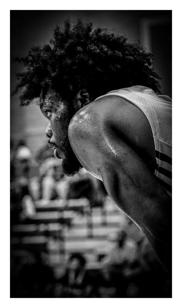 A male basketball player is seen during a game.